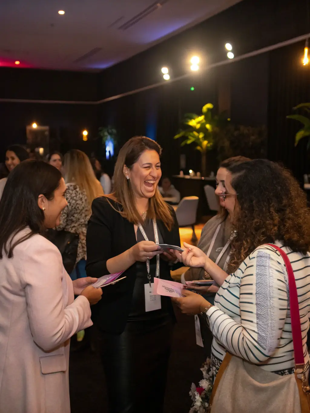 A network of women leaders connecting and collaborating at a professional event, fostering mentorship and peer support.